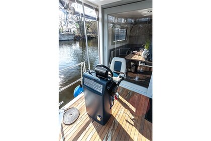 Enjoy gliding on the water with this house boat of