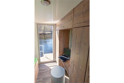 Enjoy gliding on the water with this house boat of