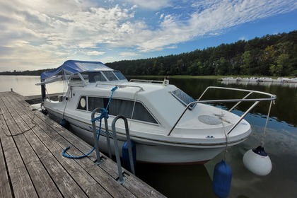 Enjoy gliding on the water with this house boat of