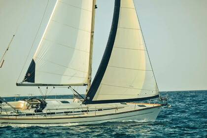 Sail in Santorini's attractions with our Bavaria 44