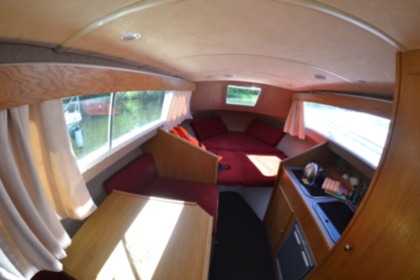 Enjoy gliding on the water with this house boat of