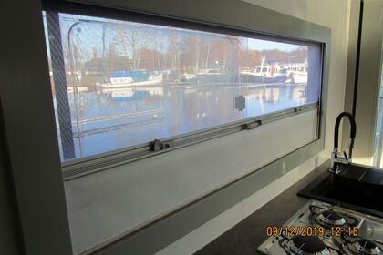 Enjoy gliding on the water with this house boat of