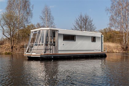 Enjoy gliding on the water with this house boat of