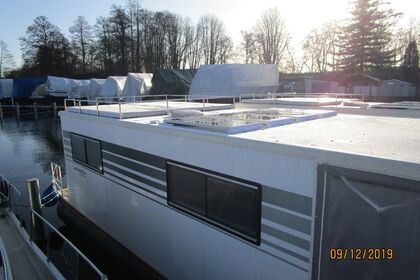 Enjoy gliding on the water with this house boat of