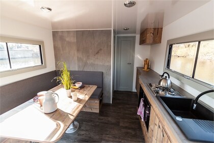 Enjoy gliding on the water with this house boat of