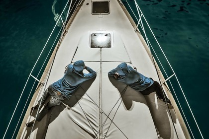 Sail in Santorini's attractions with our Bavaria 44