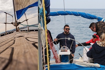 Discover Santorini's hidden gems with Odysseas sailboat