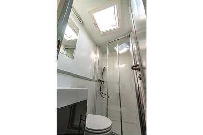 Enjoy gliding on the water with this house boat of