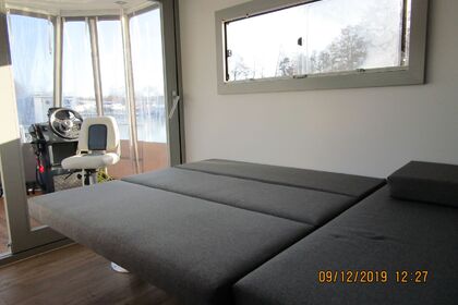 Enjoy gliding on the water with this house boat of